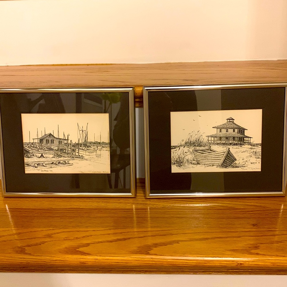 Pair of black and cream beach drawings. Matted in chrome frame with glass